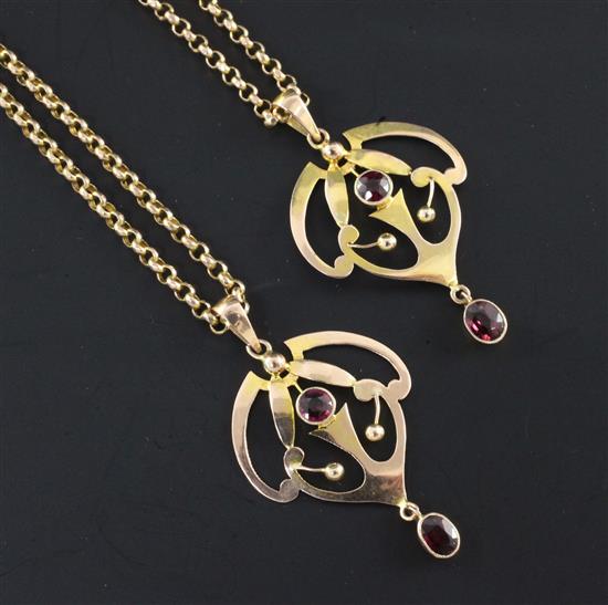 A pair of Edwardian Art Nouveau 9ct gold and garnet set drop pendants on 9ct gold chains, pendants 1.5in.